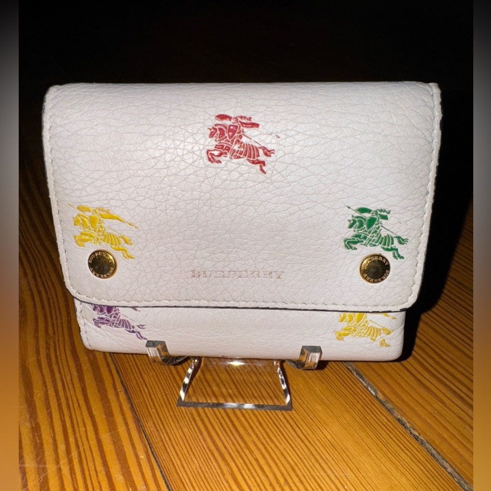 Burberry White trifold wallet with 4 card slots.  No call outs-buttery soft